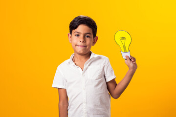 Child boy holding paper bulb. Success, motivation, winner, genius, idea concept