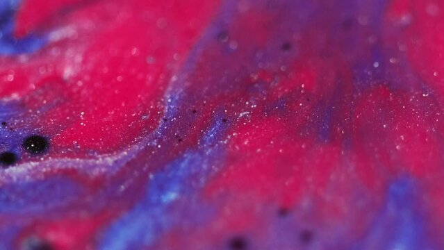 Fluid mix background. Sparkling liquid. Sequins ink art. Blur blue pink black shiny grain texture wet dye abstract splatter waves flow motion.