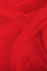 luxury folded red tulle fabric texture can be used as a wedding backdrop. Luxury Christmas...