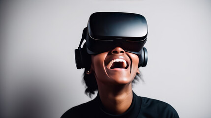 Portrait of happy smiling passionate african american black male person wearing virtual reality headset in white room.