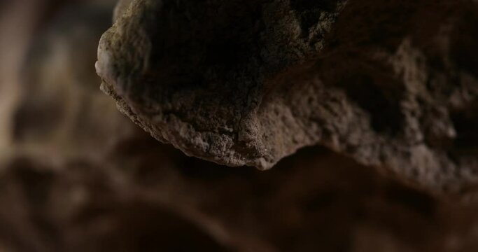 Rock Stone texture close-up. Rought mountain surface. Geological sample. Wall in cave. Macro shot natural mineral background. 