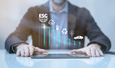 Businessman using tablet computer. ESG environmental social governance concept. Business strategy
