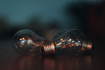 Light bulbs on the table. Wooden table. Background image. Lots of non-working light bulbs. No...