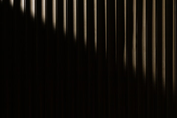 Dark brown diagonal background. Wallpaper with blinds lines. Copy space
