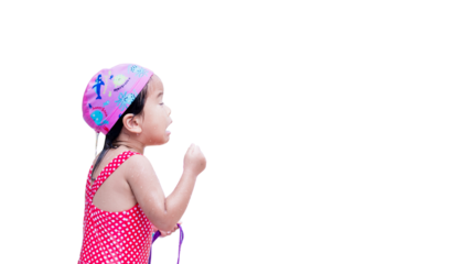 Girl Plays in the Water,Child Closes her Eyes and Water gets into her Eyes,Children Holds Purple Swimming Goggles,Kid Wears Red Swimsuit and Pink Swimming Cap. Baby aged 3 years. Isolated background.