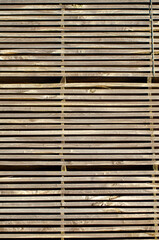 Wooden planks. Wood air drying. Wood for construction. Building material. Wood warehouse.