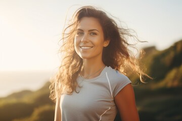 A female runner jogging outdoors in the morning against the bright and beautiful morning light