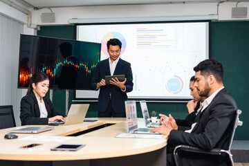 Fototapeta premium Asian business people team analyzing statistics financial. Team of businesspeople Meeting Conference Discussion Corporate Concept in office.