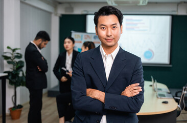 Asian business people team analyzing statistics financial. Team of businesspeople Meeting Conference Discussion Corporate Concept in office.