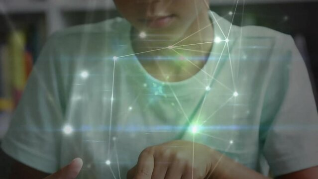 Animation of network of connections over biracial schoolboy using tablet