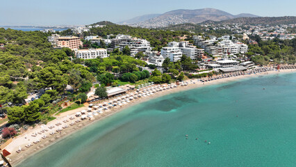 Aerial drone photo of famous celebrity sandy beach of Astir or Asteras in south Athens riviera with turquoise clear sea, Vouliagmeni, Greece