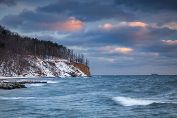 Winter landscape of Baltic Sea coast in Gdynia Orłowo at sunrise, Baltic Sea. Poland