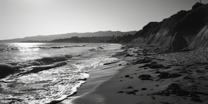 A black and white photo of a serene beach. Perfect for adding a touch of elegance to any project or design
