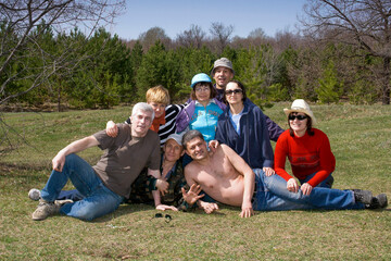 portrait of a group of mature friends outdoors on a spring sunny day