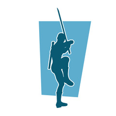 Silhouette of a male warrior in action pose with sword weapon. Silhouette of a man fighter carrying sword weapon.