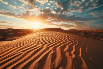 Naklejka premium A beautiful sunset scene with the sun setting over the sand dunes. Perfect for travel and nature themes