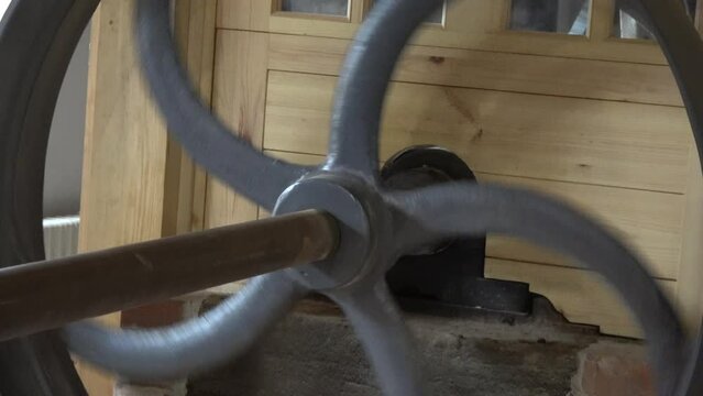 large wheel of  restored water mill in motion
