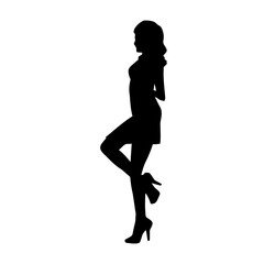 Fototapeta na wymiar Silhouette of a young slim female model in tight outfit. Silhouette of a slim woman in feminine pose.