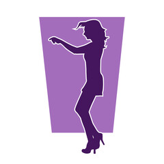 Silhouette of a slim female in dance pose. Silhouette of a woman dancing.
