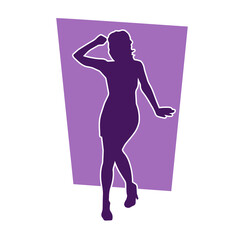 Silhouette of a slim female in dance pose. Silhouette of a woman dancing.

