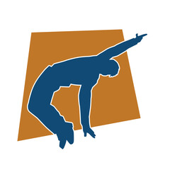 Silhouette of a slim male in dance pose. Silhouette of a man dancing.