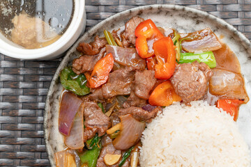 top view beef with sweet pepper and onion and rice and soup at horizontal composition