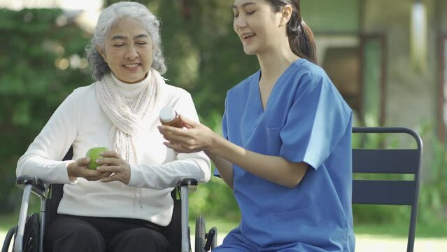 Nurse taking care of asian senior patient during rehabilitation.