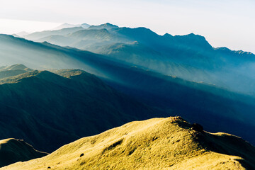 Golden hour sunlight on mountain ridges