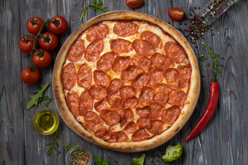 Flat lay italian pizza pepperoni with ingredients.Italy food