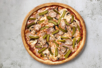 Top view delicious pizza with pickled cucumber,isolated on gray background