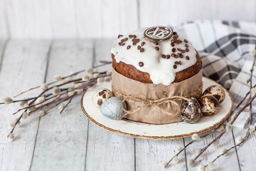 Stylish grey Easter eggs in the colors of marble, concrete, willow branches, Easter bunnies and Easter cake on a white wooden background. Coloring eggs for Easter.  The feast of bright Easter.