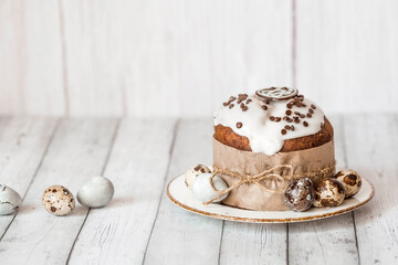 Stylish grey Easter eggs in the colors of marble, concrete, willow branches, Easter bunnies and Easter cake on a white wooden background. Coloring eggs for Easter.  The feast of bright Easter.