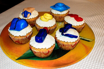 Colorful cupcakes adorned with various figures