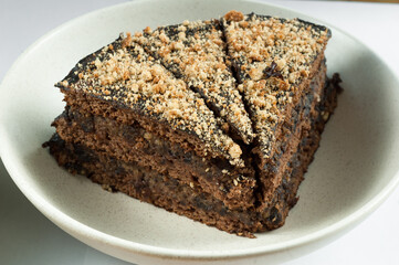 Three pieces of chocolate cake on a plate
