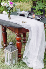 Bride and groom wedding table in a garden. Vertical orientation - 706327920