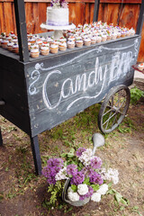 Black wooden cart as a candy bar. - 706327999