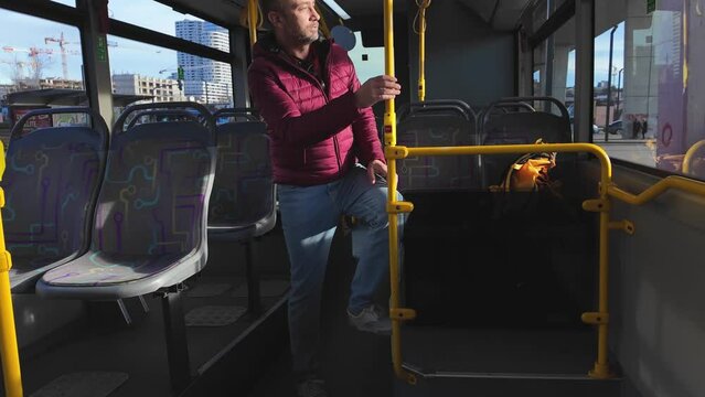 Commuter inside a bus at city station.