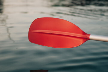 Kayak oar above the water surface of the river. - 706329184