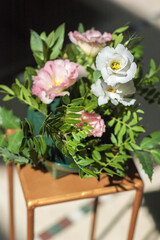 Flower arrangement on a golden centerpiece