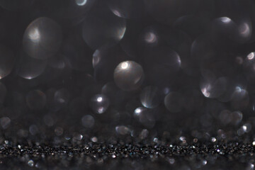 Glitter vintage lights background, light silver and black