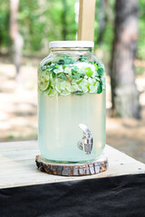 Homemade mojito in glass jar on wooden table. - 706331328
