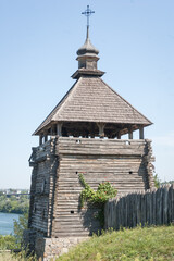 Wooden watchtower on the territory of historical-cultural complex 'Zaporizhzhya Sich' on Khortytsia island, Zaporizhzhia, Ukraine. Vertical orientation. - 706331349