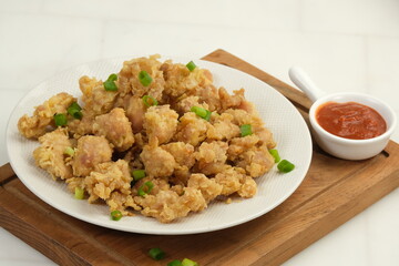 Homemade Crispy Popcorn Chicken with chilli Sauce and mayonnaise on white background