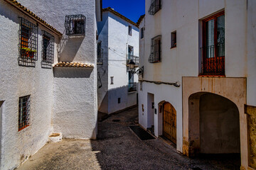 Fototapeta na wymiar urban narrow street in the Spanish city of Altea on a summer day