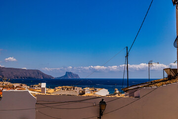 urban narrow street in the Spanish city of Altea on a summer day
