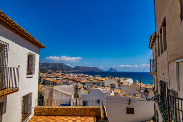 urban narrow street in the Spanish city of Altea on a summer day