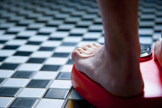 Close up of Feet on Weighing Scale
