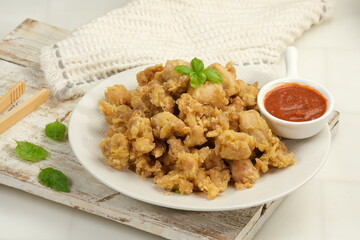 Homemade Crispy Popcorn Chicken with chilli Sauce and mayonnaise on white background