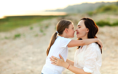 Obraz premium Mother and daughter on sandy beach