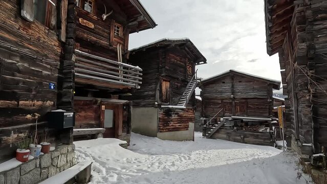 Old huts and cabins in the village of Bellwald in Switzerland. Beautiful Swiss mountain village in winter